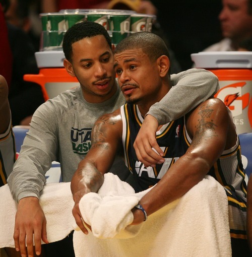 Steve Griffin  |  The Salt Lake Tribune

Utah's Devin Harris puts his arm around teammate Earl Watson after Watson came out of the game late in second half action in the Jazz Lakers game at the Staples Center in  in Los Angeles, CA Wednesday, December 28, 2011.