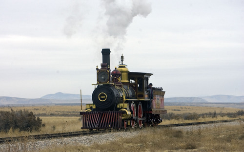 Al Hartmann  |  The Salt Lake Tribune
Union Pacific steam locomotive 199 rolls down the track to the Golden Spike National Historic Site visitor center in northwestern Utah on Wednesday, Dec. 28, 2011. Golden Spike holds its annual Winter Steam Festival on December 28-30 Folks can get up close to tour the locomotive cab, see steam demonstrations as well as take a ride on a muscle powered handcart.