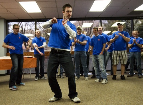 Kim Raff  I  The Salt Lake Tribune
Fishbowl employee Cade Close dances Thursday as the Orem company celebrates paying off its $1 million loan from Zions Bank. The money was used to fund an employee buyout of the software company years earlier than expected.