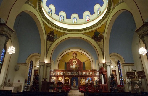 Leah Hogsten | The Salt Lake Tribune  
The sanctuary of Salt Lake City's Holy Trinity Greek Orthodox Church boasts religious icons in mosaic, wood panels and stained glass. There also are large flat scenes. 