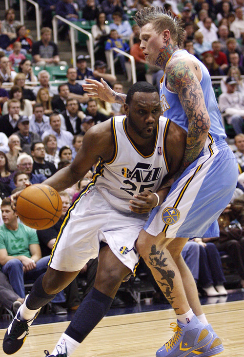 Djamila Grossman  |  The Salt Lake Tribune

The Utah Jazz' Al Jefferson (25) pushes past the Denver Nuggets' Chris Andersen (11) during the second half of a game at Energy Solutions Arena in Salt Lake City, Utah, on Wednesday, April 13, 2011. The Jazz won the game.