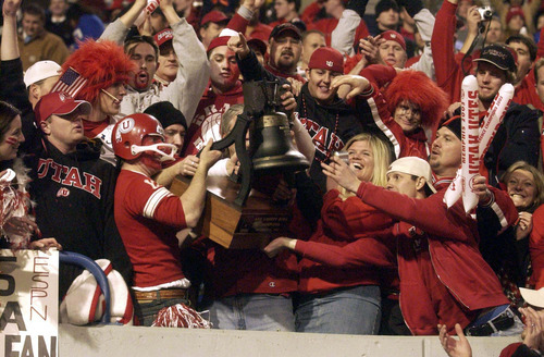Utah football fans hold the Liberty Bowl trophy after the Utes defeated Southern Mississippi in the 45th Annual AXA Liberty Bowl. December 31, 2003 in Memphis, Tennessee.

Tribune file photo