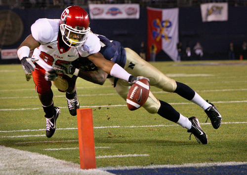 Scott Sommerdorf / The Salt Lake Tribune

Utah WR Jereme Brooks stretches for what looked like a TD, but officials ruled he lost control of the ball just as it hit the pylon and went out of bounds late in the second half vs Navy during the Poinsettia Bowl in San Diego, California, January 2, 2007.  Utah won the game 35-32.
