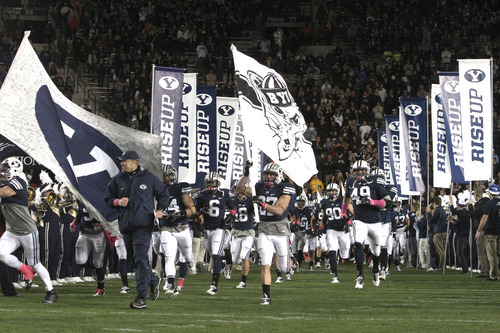 Rick Egan  | The Salt Lake Tribune 

Bronco Mendenhall takes the field with the Brigham Young Cougar football team, as they prepare to face the San Jose State Spartans,  at Lavell Edwards stadium, Saturday, October 8, 2011.