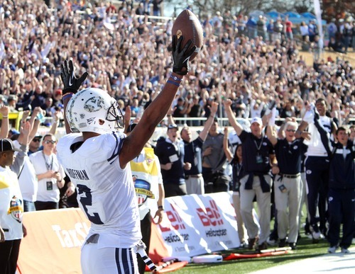 Rick Egan  | The Salt Lake Tribune 

Wide receiver Cody Hoffman (2) celebrates the winning touchdown in the 24-21 win over Tulsa in the Armed Forces Bowl, in Dallas, Texas, Friday, December 30, 2011
