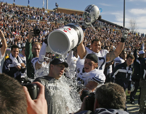 Rick Egan  | The Salt Lake Tribune 

Brigham Young Cougars head coach Bronco Mendenhall gets drenched with Powerade as BYU celebrates their 24-21 win over Tulsa in the Armed Forces Bowl, in Dallas, Texas, Friday, December 30, 2011