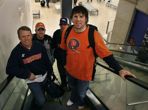 Scott Sommerdorf  |  The Salt Lake Tribune             
Jon Kraus, right, of Logan, and friends, Regan Hoth, front left, and Ryan and Rusty Hoth behind, go up the escalator at Salt Lake International airport to take their flight to Denver to see the Broncos play the Patriots, Sunday, December 18, 2011.