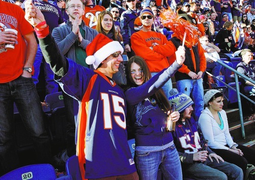 Scott Sommerdorf  |  The Salt Lake Tribune             
Dean Testa and his girlfriend Amy Jones cheer during the Broncos vs Patriots NFL football game. The New England Patriots beat the Denver Broncos 41-23, Sunday, December 18, 2011.