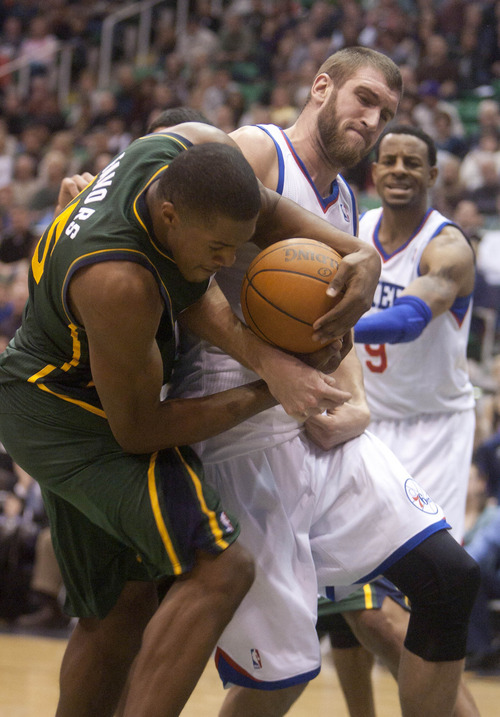 Jeremy Harmon  |  The Salt Lake Tribune

Utah's Derrick Favors (15) and Philadelphia's Spencer Hawes (00) fight for the ball as the Jazz face the 76ers at EnergySolutions Arena on Friday, December 30, 2011.