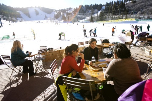 Kim Raff I The Salt Lake Tribune
On a cloudless New Year's Day, (from left) Samara Vassiliou, Amani Vassiliou and Tracey Rondo sit coatless while eating lunch in the warm sun at Snow Park Lodge at Deer Valley Resort in Park City.