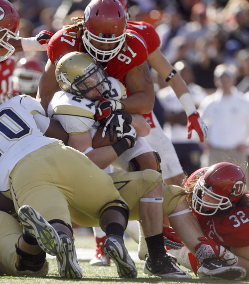 Utah's Tevita Finau tackles Georgia Tech's Preston Lyons during the second quarter in the Sun Bowl NCAA college football game on Saturday, Dec. 31, 2011, in El Paso, Texas. Utah won 30-27 in overtime. (AP Photo/The Salt Lake Tribune, Trent Nelson)  DESERET NEWS OUT; LOCAL TV OUT