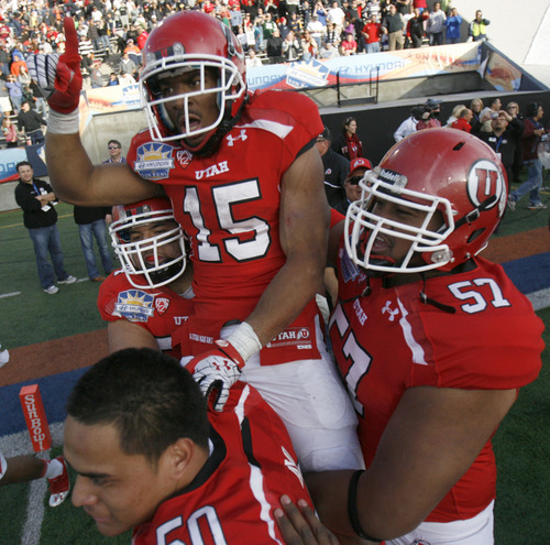 Utah's John White celebrates his game-winning touchdown in overtime against Georgia Tech in the Sun Bowl NCAA college football game on Saturday, Dec. 31, 2011, in El Paso, Texas. Utah won 30-27 in overtime. (AP Photo/The Salt Lake Tribune, Trent Nelson)  DESERET NEWS OUT; LOCAL TV OUT