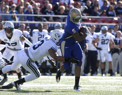 Rick Egan  | The Salt Lake Tribune 

 Tulsa Golden Hurricane wide receiver Ricky Johnson (5), runs with the ball as  Brigham Young Cougars linebacker Kyle Van Noy (3) makes the tackle, in the Armed Forces Bowl, in Dallas, Texas, Friday, December 30, 2011
