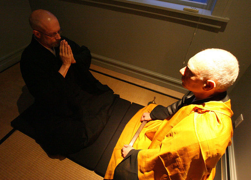 In this 2005 Tribune file photo, Genpo Roshi Dennis Merzel, right, interviews Michael Zimmerman to test his conceptual mind and transcendental understanding to help him go beyond the dualistic mind.