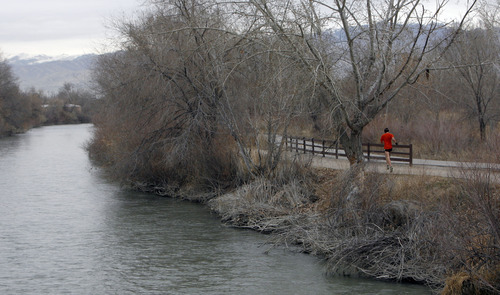 Francisco Kjolseth  |  The Salt Lake Tribune
A runner heads down the Jordan River Parkway near 5400 South in December. The Jordan River Commission has been awarded a grant from the River and Trails Conservation Assistance Program, run by the National Park Service. The money will help develop an interpretive trail map for the Jordan River Parkway.