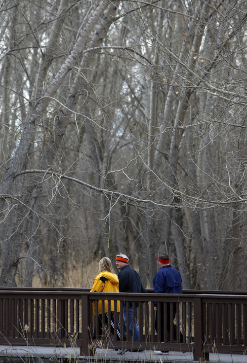 Francisco Kjolseth  |  The Salt Lake Tribune
People walk along the Jordan River Parkway in December near 5000 South. The Jordan River Commission has been awarded a grant from the River and Trails Conservation Assistance Program, run by the National Park Service. The money will help develop an interpretive trail map for the Jordan River Parkway.