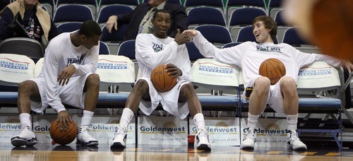 Steve Griffin  |  The Salt Lake Tribune

Jazz players Alec Burks, Jeremy Evans and Gordon Hayward laugh on the bench before they warm-up before their game against the Bucks at EnergySolutions Arena in Salt Lake City, Utah  Tuesday, January 3, 2012.
