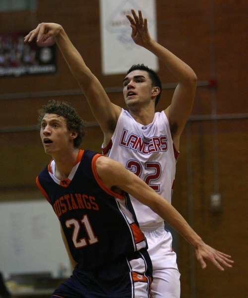 Steve Griffin  |  The Salt Lake Tribune

Granger's Taylor Pili  shoots over Mt. Crest's Cody Perkes during game at Granger High School in West Valley City, Utah  Wednesday, January 4, 2012.