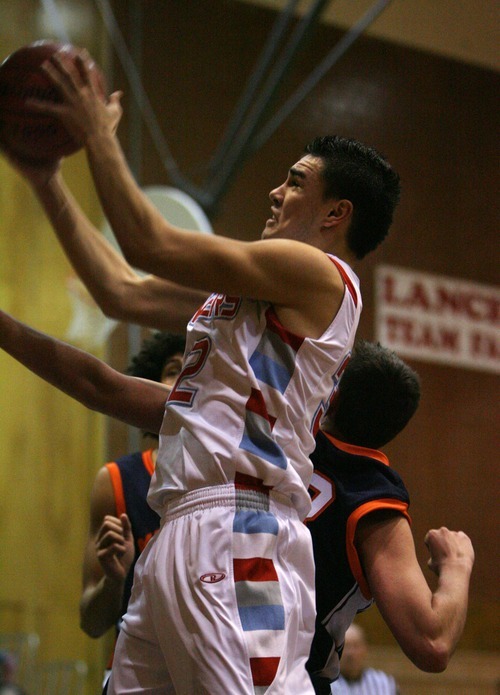 Steve Griffin  |  The Salt Lake Tribune

Granger's Taylor Pili  shoots in the lane during game against Mt. Crest's at Granger High School in West Valley City, Utah  Wednesday, January 4, 2012.