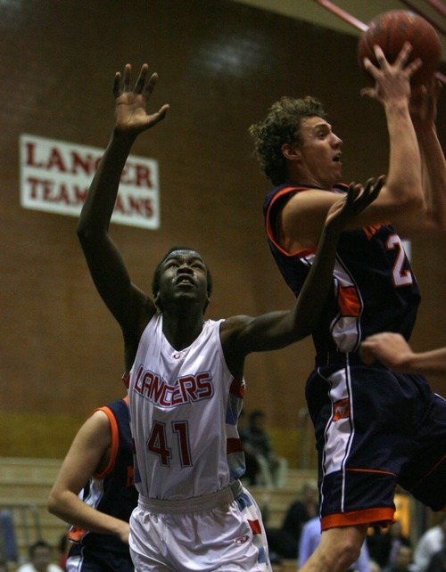 Steve Griffin  |  The Salt Lake Tribune

Mt. Crest's Cody Perkes pulls a rebound away from Granger's Makol Mawien  during at Granger High School in West Valley City, Utah  Wednesday, January 4, 2012.