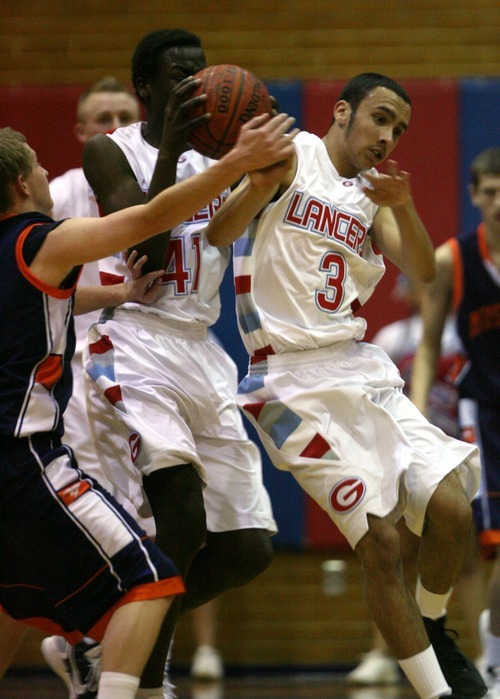 Steve Griffin  |  The Salt Lake Tribune

Granger guard Israel Tademy, right, crashes into teammate Makol Mawien as they go for the ball in front of Mt. Crest's Jaxon Webb during game at Granger High School in West Valley City, Utah  Wednesday, January 4, 2012.