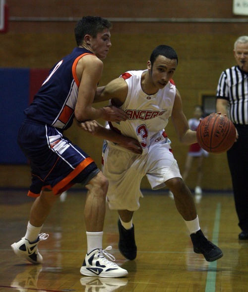 Steve Griffin  |  The Salt Lake Tribune

Granger guard Israel Tademy drives past Mt. Crest's Tyler Crosbkie during game at Granger High School in West Valley City, Utah  Wednesday, January 4, 2012.