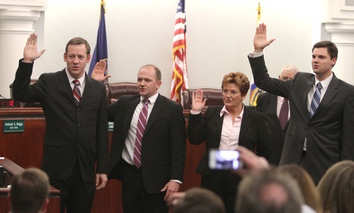 Rick Egan  | The Salt Lake Tribune
West Jordan swears in from left: City Council members Chris McConnehey, Ben Southworth, Judy Hansen and Justin D. Stoker, on Wednesday.