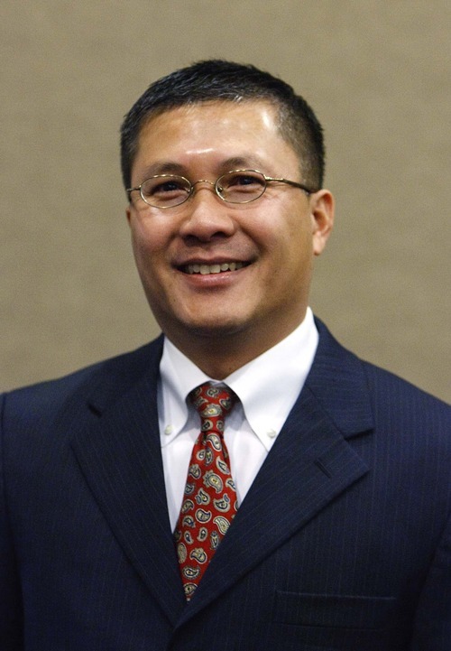 Leah Hogsten | The Salt Lake Tribune  
West Valley City new council member Tom Huynh is one of three new council members swearing-in, Tuesday, January 3, 2012. Huynh was one of three new council members.