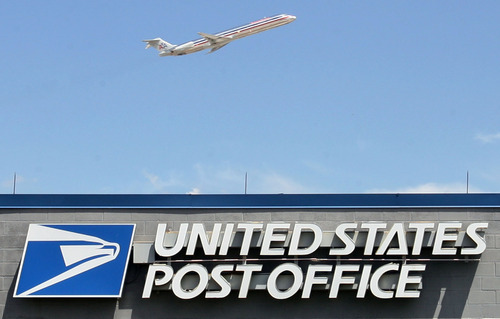 Steve Griffin  |  The Salt Lake Tribune file photo

Jets fly over the airport U.S. Post Office as they take off from the Salt Lake City International Airport. The Post Office is considering closing this office along with 13 other offices in Utah.