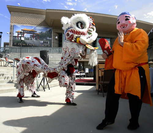 Rick Egan   |  Tribune file photo
Performers show the traditional Lion Dance at the ground breaking ceremony for the Chinese Heritage Gate in July 2011.