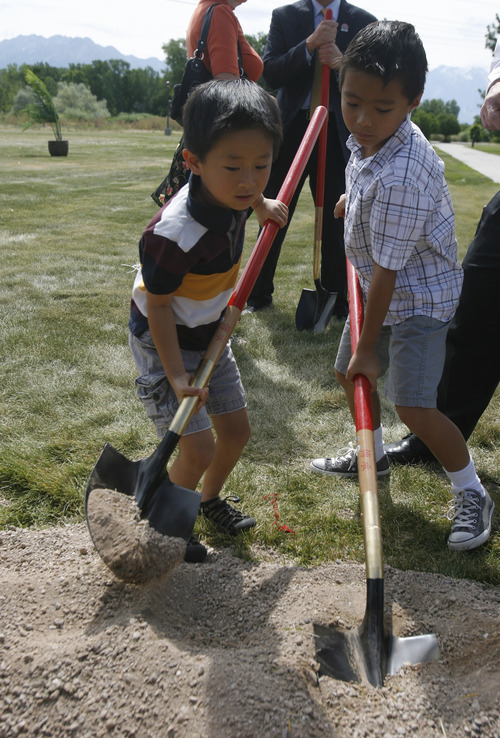 Rick Egan   |  Tribune file photo
Dillon Fang, 5, and his brother, Logan Fang, 7, of Bountiful, turn over a shovel of dirt at the groundbreaking ceremony for the Chinese Heritage Gate at the Utah Cultural Celebration Center in West Valley City on  July 26, 2011. The Chinese Heritage Gate commemorates the local Chinese community and the connection between West Valley City and Nantou, Taiwan.
