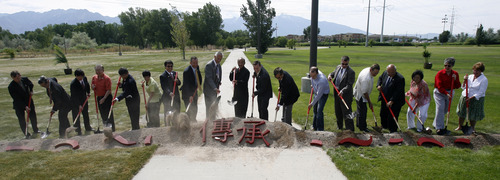 Rick Egan   |  Tribune file photo
Dignitaries turn over dirt at the groundbreaking ceremony for the Chinese Heritage Gate at the Utah Cultural Celebration Center in West Valley City on July 26, 2011. The Chinese Heritage Gate commemorates the local Chinese community and the connection between West Valley City and Nantou, Taiwan.