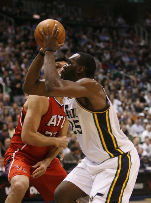 Steve Griffin  |  The Salt Lake Tribune
Utah's Al Jeffereson pump fakes Atlanta Hawks center Zaza Pachulla during first half action of the Jazz versus Hawks game at EnergySolutions Arena in Salt Lake City Wednesday, January 5, 2011.