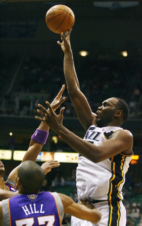 Djamila Grossman  |  The Salt Lake Tribune

Utah Jazz center Al Jefferson #25 attempts to score as he is blocked by several Phoenix Suns players  at a game in Salt Lake City, Thursday, October 28, 2010. The Jazz lost the game.