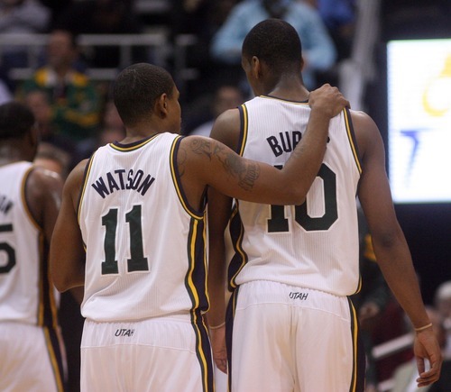 Steve Griffin  |  The Salt Lake Tribune

Utah's Earl Watson puts his arm around Alec Burks as he gives him a pointer during a game against the Milwaukee Buck at EnergySolutions Arena in Salt Lake City on Tuesday, Jan. 3, 2012.