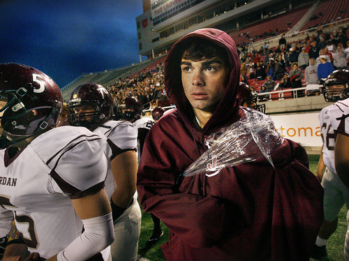 Scott Sommerdorf  |  The Salt Lake Tribune             
Injured Jordan QB Austin Kafentzis watches the last minutes of the loss to Lone Peak on th esidelines with his broken collarbone wrapped. Lone Peak scored a TD at 0:31 of the game to beat Jordan 45-41 in a 5A semifinal game at Rice-Eccles Stadium, Friday, November 11, 2011.