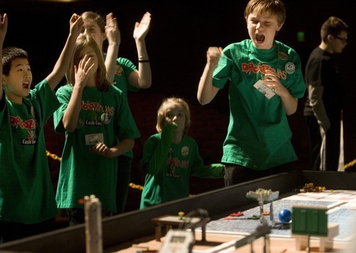 Kim Raff I The Salt Lake Tribune
Droidzilla, a team based out of the Boys & Girls Club of South Valley, celebrates a score during a Utah FIRST LEGO League competition at Murray High School on Saturday.