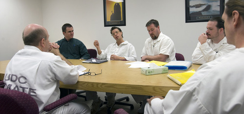 Al Hartmann   |  The Salt Lake Tribune 
Dr. Sean Casey,  upper left, works with prison inmates Nicholas Lear, Steven Swena, Sam Greene, George Schliesser, Shon Johnson and Michael Barrett, (back),  in a group therapy session in the sex offender treatment program.