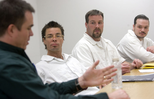 AAl Hartmann   |  The Salt Lake Tribune 
Dr. Sean Casey, left, works with prison inmates Nicholas Lear, Steven Swena, and Sam Greene in a group therapy session in the sex offender treatment program.