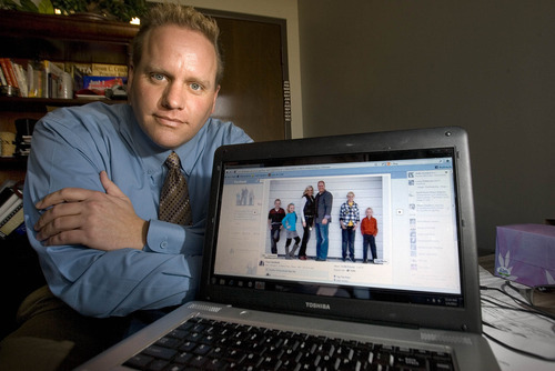 Paul Fraughton | The Salt Lake Tribune.
Troy Critchfield with a family photo from his Facebook page. Critchfield shares the same name of a man convicted of a felony and currently charged with rape and kidnapping.  Since he was a teenager, Mr. Critchfield, who is a family man and good citizen, has been dealing with being confused with the felon.