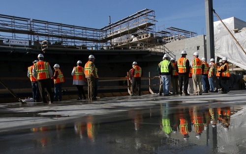 Steve Griffin  |  The Salt Lake Tribune

City officials and others tour the ongoing construction of the new Granger High School in West Valley City on Monday, Jan. 9, 2012. The new school is scheduled to open for the 2013 school year and is being built next to the existing high school.