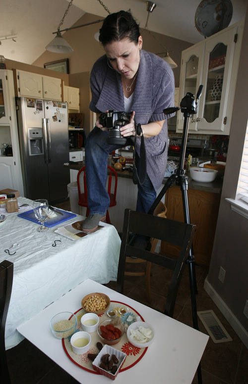 Francisco Kjolseth  |  The Salt Lake Tribune
Allison Czarnecki, a mommy blogger from Spanish Fork, takes advantage of window light to document a new vegan recipe in her kitchen for the family dinner on Monday, Jan. 9, 2012. Czarnecki, who started her blog petitelefant.com in 2007, has a following of about half a million a month. A recent study shows that stay-at-home moms who blog are much happier due to an increased social network that keeps them connected.