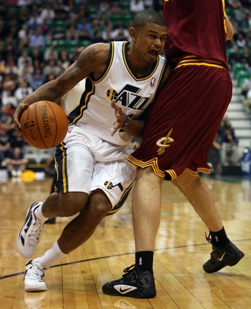 Steve Griffin  |  The Salt Lake Tribune

Utah's Earl Watson crashes into Cleveland's Semih Erden during first half action in the Jazz Cleveland game at EnergySolutions Arena in Salt Lake City, Utah  Tuesday, January 10, 2012.