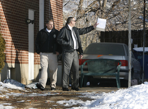 Scott Sommerdorf  |  The Salt Lake Tribune                      
Police investigators exit the home at 3268 Jackson Ave., in Ogden, where a fatal shoot out occurred last Wednesday. Later Monday, Weber County Attorney Dee Smith spoke at a press conference updating the investigation.  Monday, January 9, 2012.