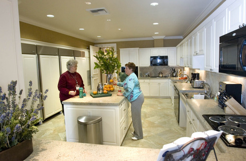Paul Fraughton | The Salt Lake Tribune
Elaine  Jensen and Mary Howser chat Monday, Jan. 9, 2012, in the massive kitchen of the Fisher House. The house, located on the VA hospital campus in Salt Lake City,  provides  free housing for family members of those being treated at the hospital.