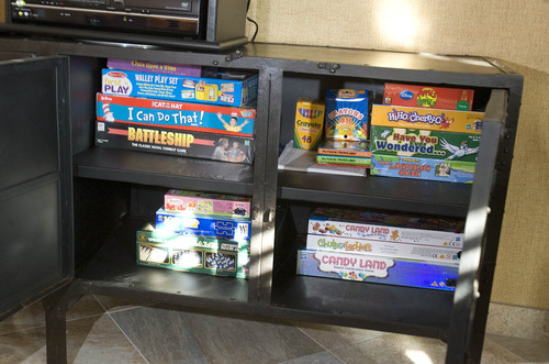 Paul Fraughton | The Salt Lake Tribune
 A cabinet at The Fisher House  is filled with board games. The house, located on the VA hospital campus in Salt Lake City,  provides  free housing for family members of those being treated at the hospital.