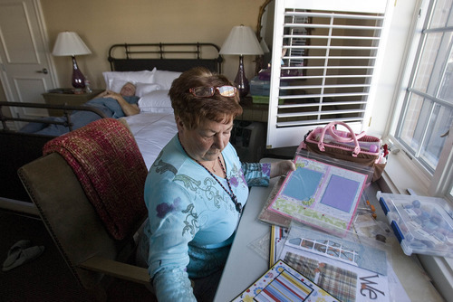 Paul Fraughton | The Salt Lake Tribune
Jack Howser relaxes  on his bed at the Fisher House, while his wife Mary  prepares to work on a scrapbooking project. The couple, from Montana,  are staying at the house while Floyd has out-patient treatments at the VA hospital in Salt Lake City.