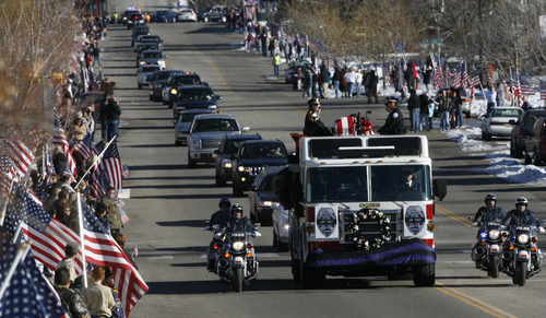 Francisco Kjolseth  |  The Salt Lake Tribune
Thousands turn up to pay their respects for slain Ogden police Officer Jared Francom along the funeral procession route in Ogden on Wednesday, January 11, 2012.