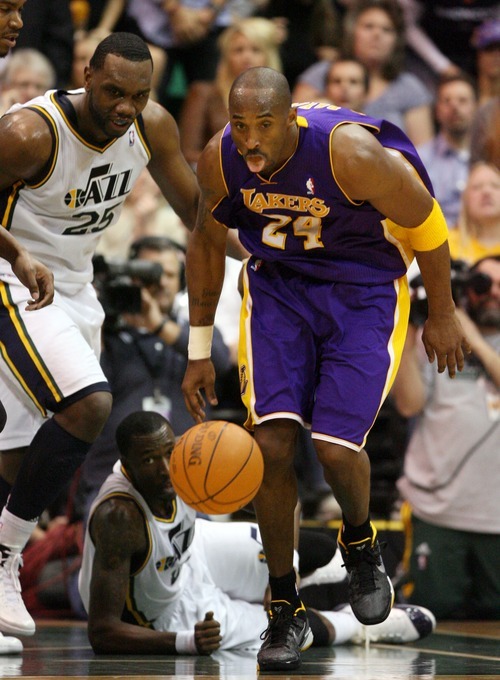 Steve Griffin  |  The Salt Lake Tribune

Kobe Bryant, of the Lakers, scoops up the ball and heads up court during second half action of the Jazz versus Lakers game at EnergySlutions Arena in Salt Lake City, Utah  Wednesday, January 11, 2012.