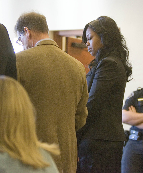 Paul Fraughton | The Salt Lake Tribune.
Shirley Lewis, who is accused of assaulting her boyfriend, Jazz center Al Jefferson stands with her lawyer Wally Bugden  at a hearing in a Holladay courtroom.
 Wednesday, January 11, 2012